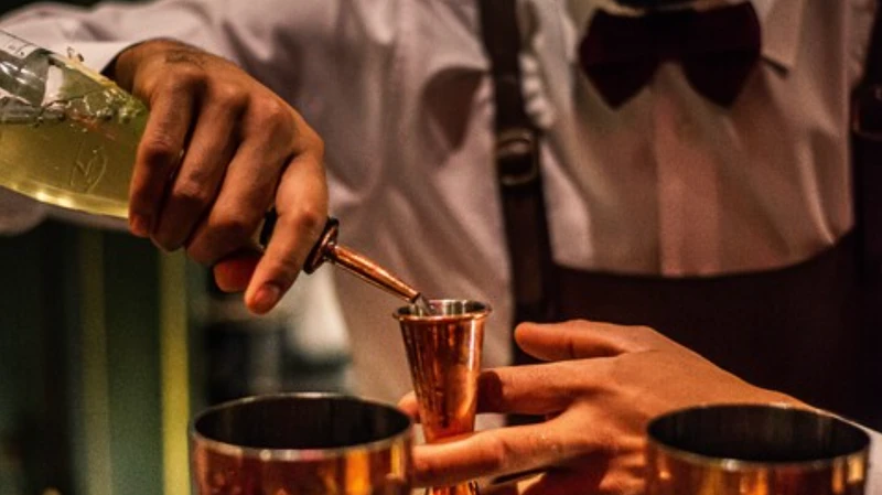 A barman preparing a cocktail